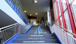 Go up the stairs to the second floor